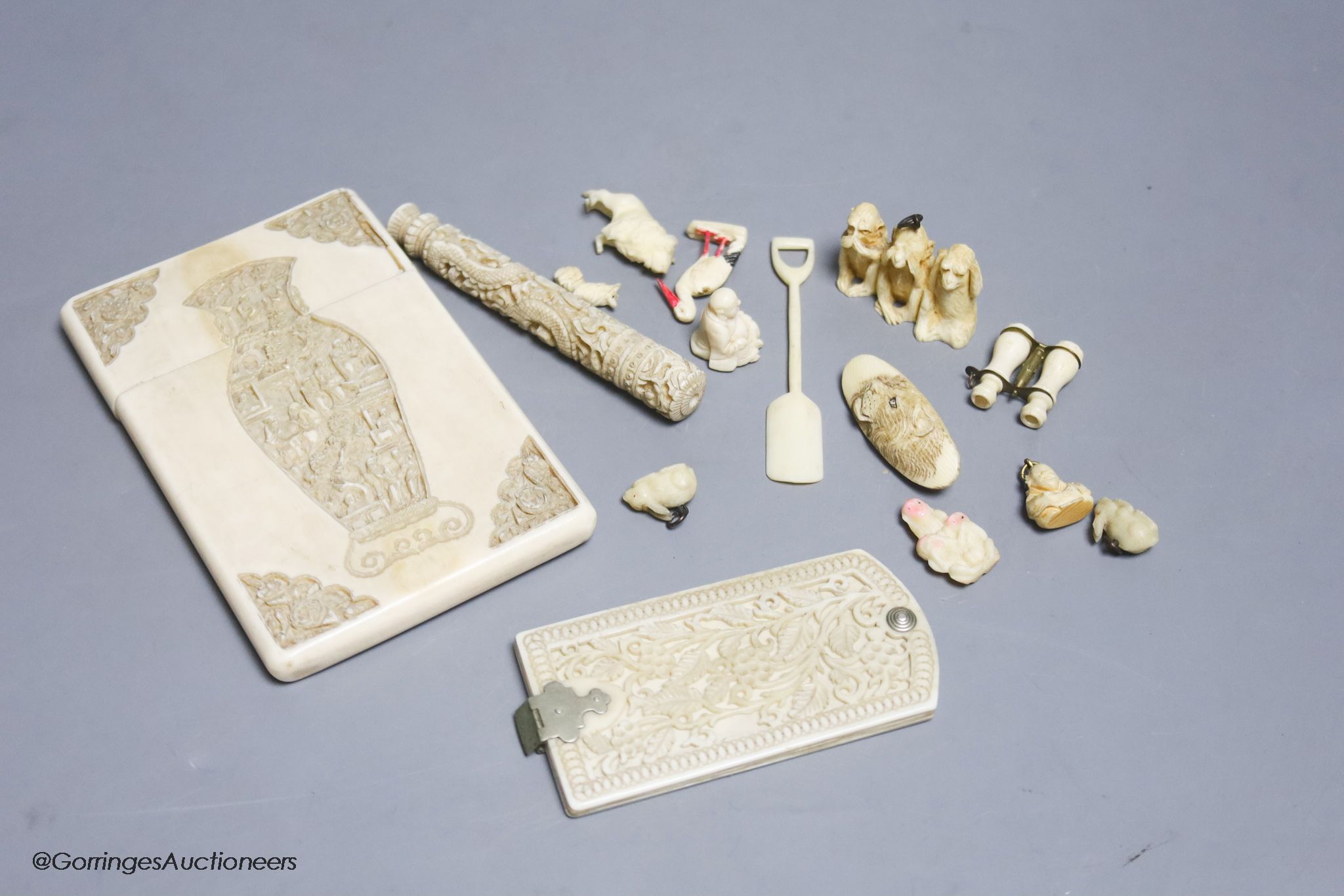 A late 19th century Chinese carved ivory card case, a similar needle case, an aide-memoire and sundries